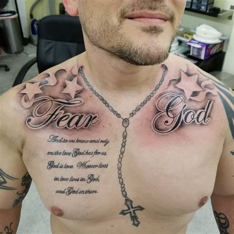 The chest, shoulders, and arms are the most common canvas options for this elaborate body art. . Fear god chest tattoo